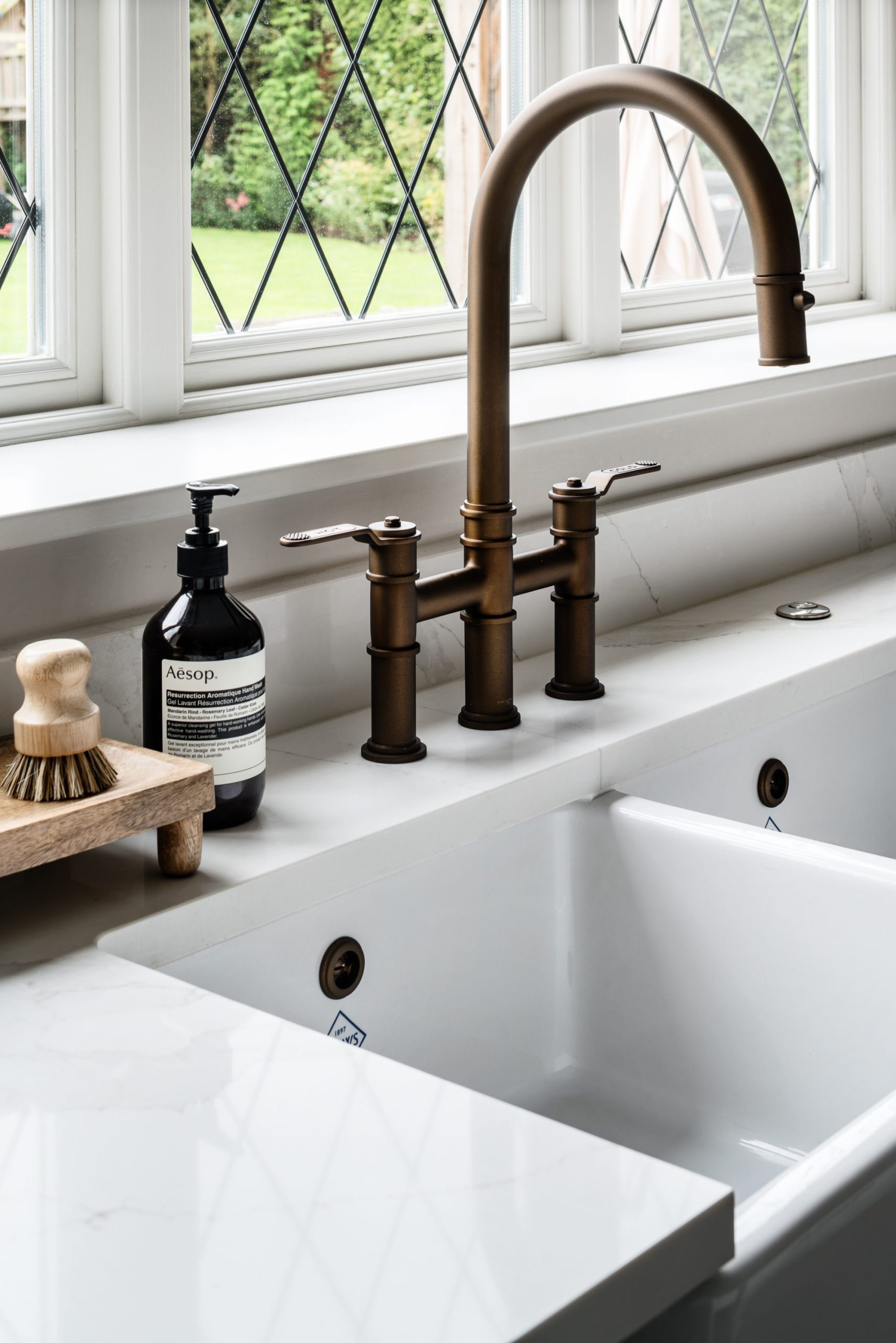 Kitchen sink with bronze Perrin & Rowe mixer tap