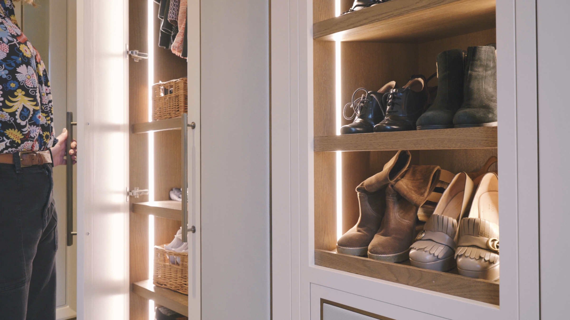 Helen opening the wardrobe to show the bespoke shoe rack