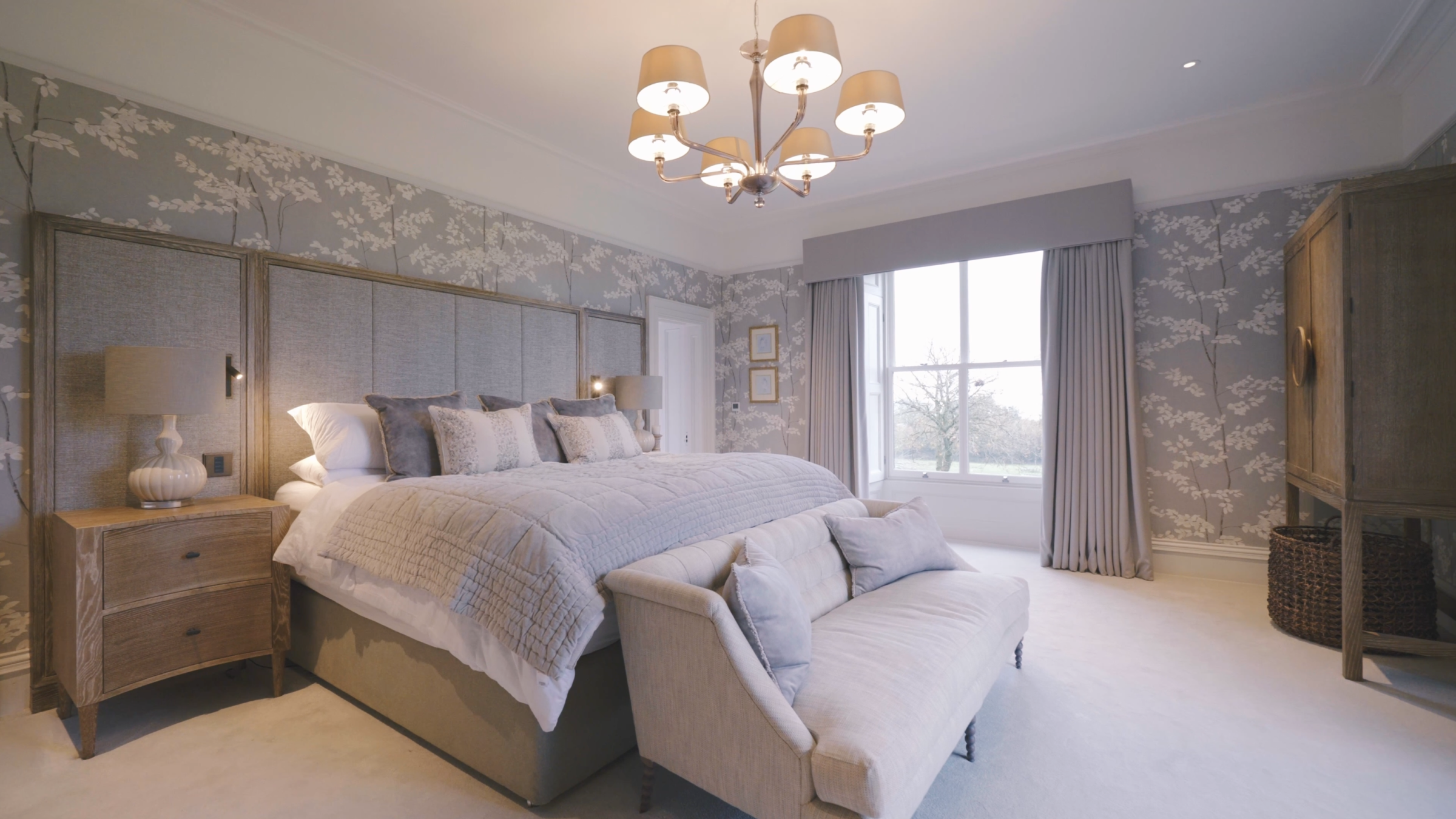 Cream bed with full length headboard in master bedroom