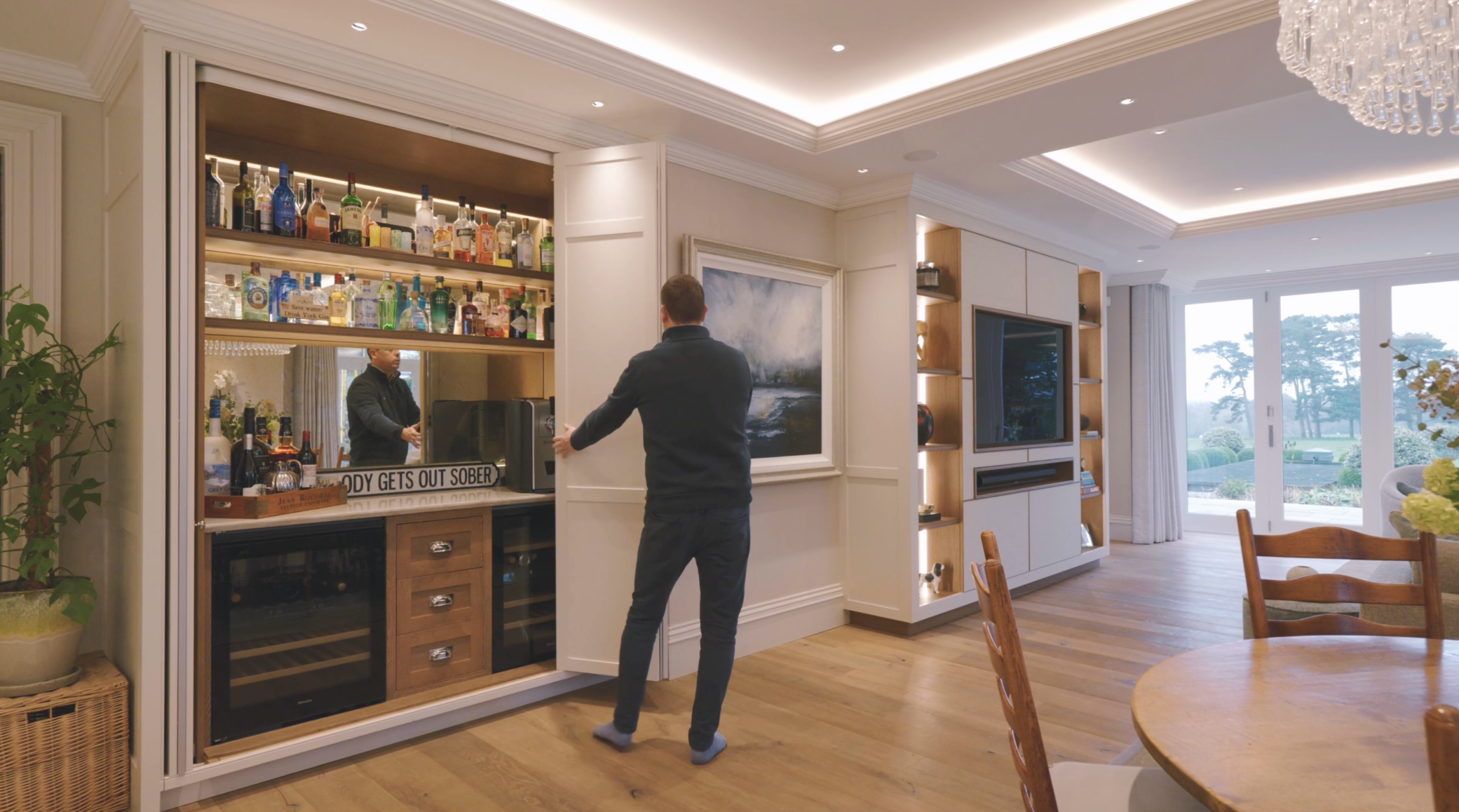 Simon unveiling the hidden bar area in kitchen