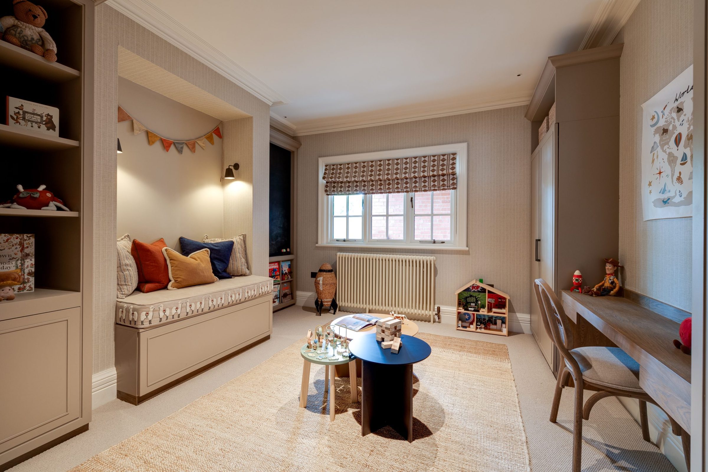Children’s playroom with built-in bench seat, soft neutral palette and playful accessories